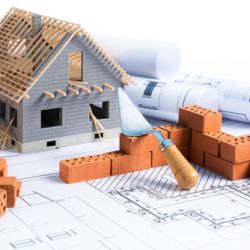 House,In,Construction,-,Project,With,Brick,And,Blueprint